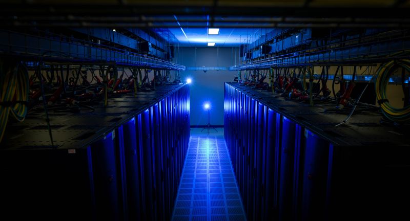 An image of computer equipment illuminated by blue light