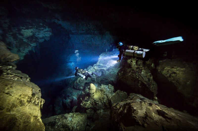 Divers descending into Vintany cave in Madagascar