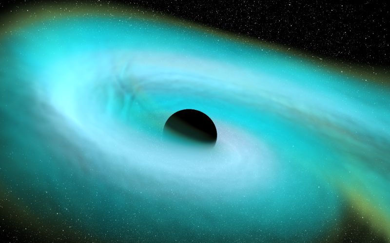 A black sphere orbited by a glowing, bluish swirl, against a black background.