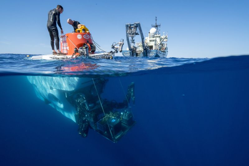 Alvin swimmers preparing the sub at the surface for recovery operations.