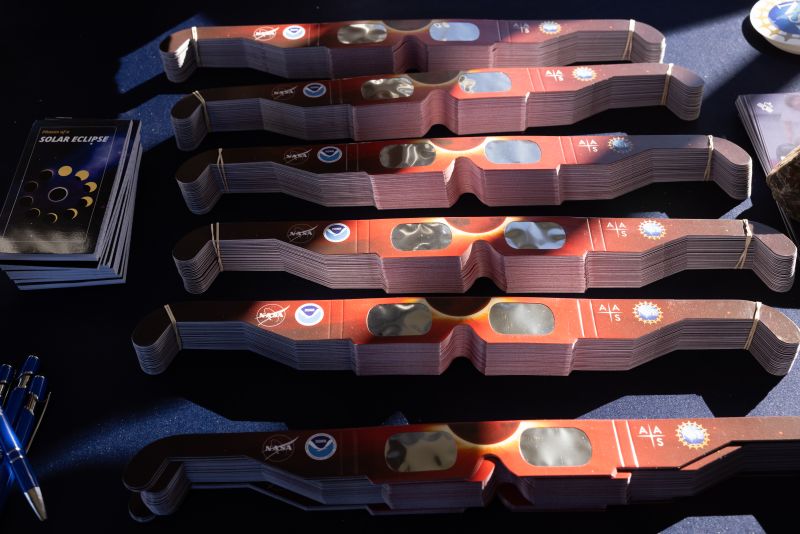 A collection of special eclipse sunglasses on a table