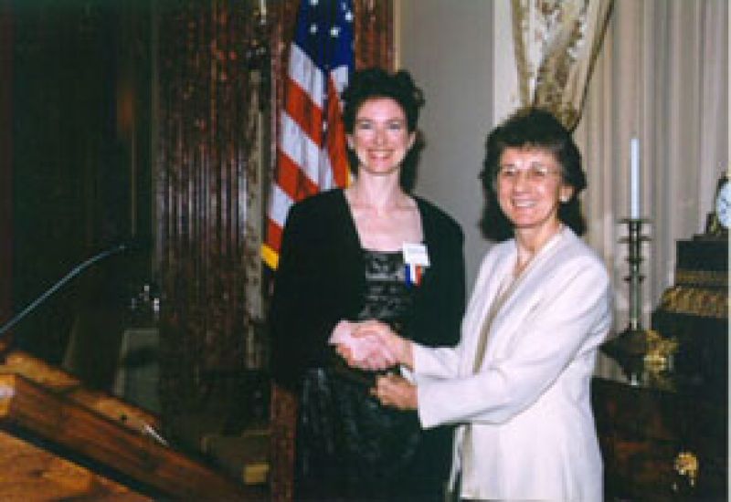 Jennifer A. Doudna, and Rita Colwell, NSF Director shaking hands