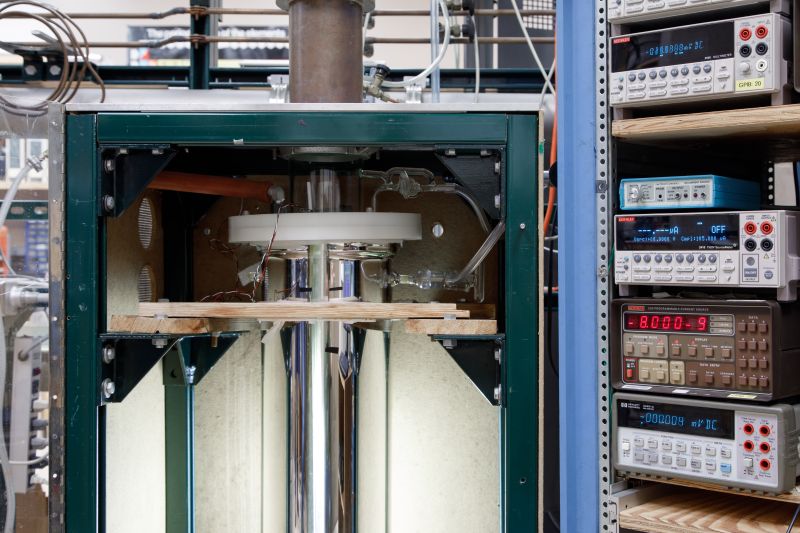 Interior view of large lab equipment with control panels at the right.