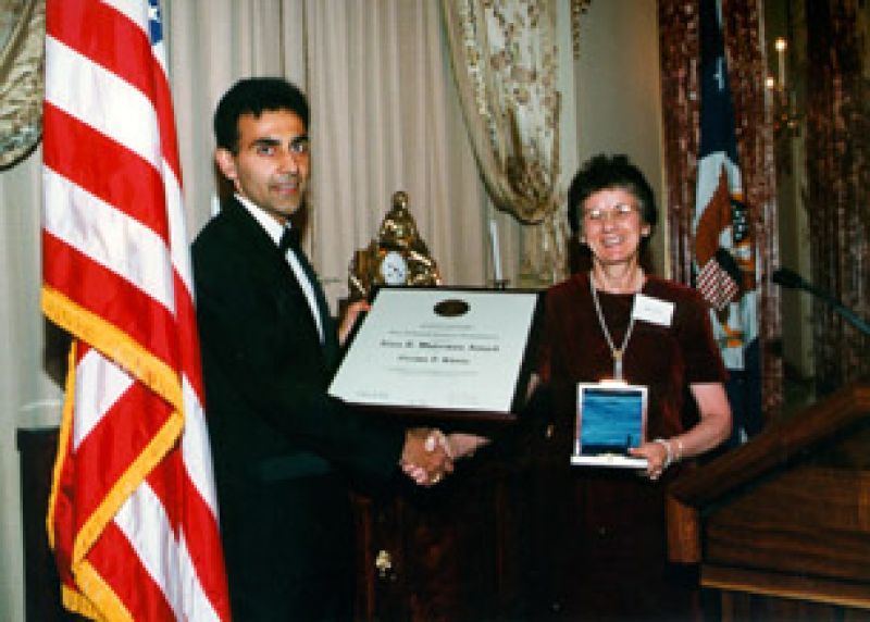 Chaitan S. Khosla and Rita Colwell, NSF Director holding a framed plaque award