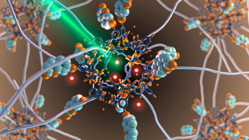 3D rendering of molecules and a green beam of light.
