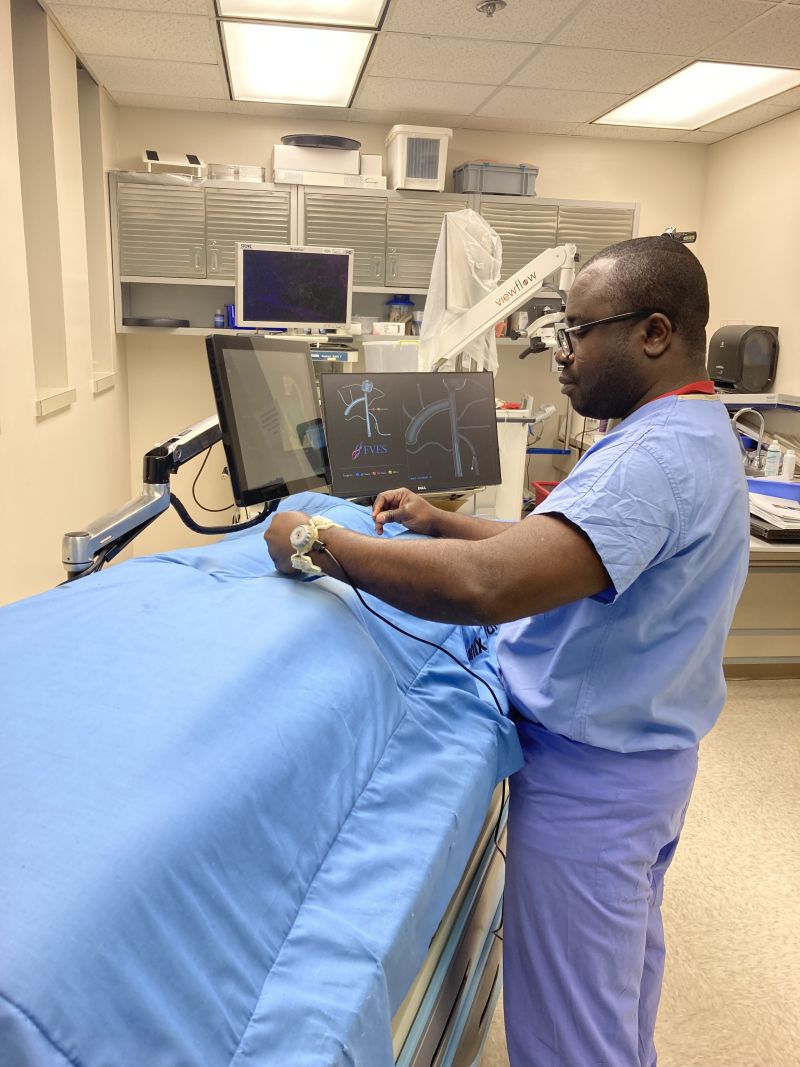 Resident trainee performing endovascular navigation task in simulation