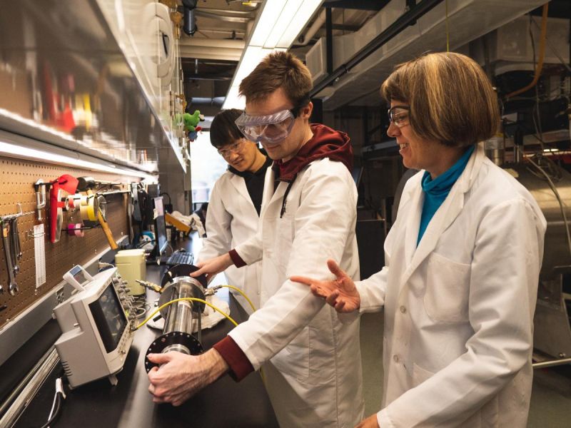 Graduate students work in the laboratory with Sophia Hayes (right)