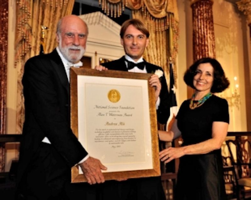Austin (center), with National Science Board Member Vint Cerf (left), and NSF Director France Córdova holding a framed plaque