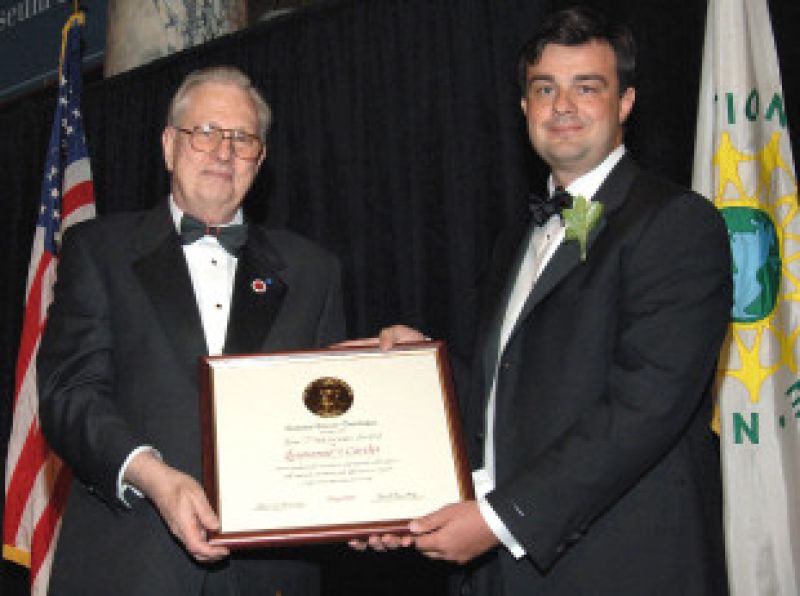 Emmanuel Candes with Arden L. Bement, Jr., NSF Director holding a plaque award