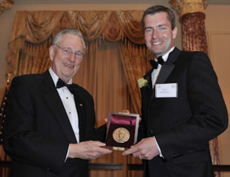 David Charbonneau with Arden L. Bement, Jr., NSF Director holding a plaque award