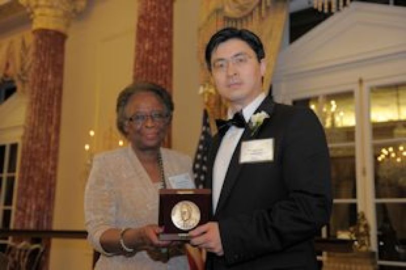 Cora Marrett, NSF Acting Director and Mung Chiang holding award