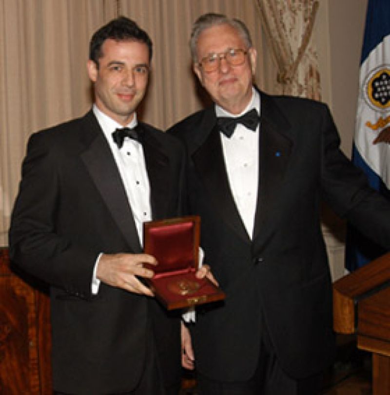 Dalton Conley with Arden L. Bement, Jr., NSF Director holding an award medal