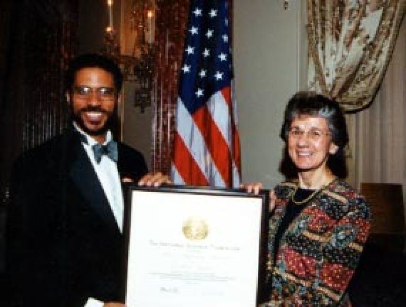 Erich D. Jarvis and Rita Colwell, NSF Director holding a framed plaque award