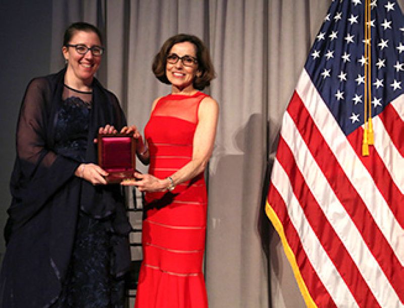 woman receiving award from woman director Cordova
