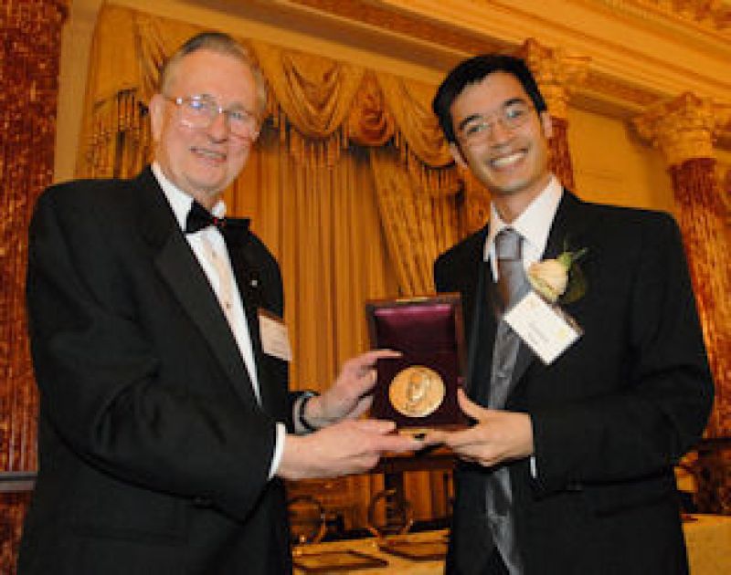 Terence Tao with Arden L. Bement, Jr., NSF Director holding a medal award