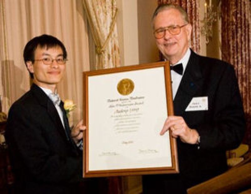 Peidong Yang with Arden L. Bement, Jr., NSF Director holding a framed award