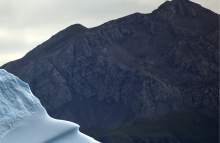 Mountain with iceberg in front