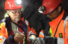 Orange helmets in a mine