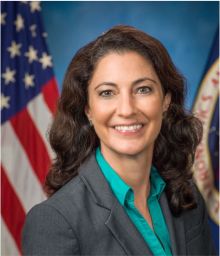Portrait of Carla Haroz with US flag in the background