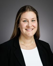 A person smiling to the camera.