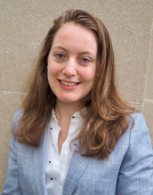 portrait of Marion Dierickx with mid length hair wearing a blue blazer