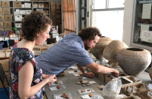 Archeologists sorting clay artifacts