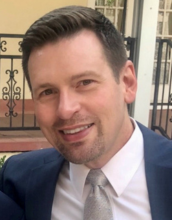 portrait of William Kinser wearing a suit and tie