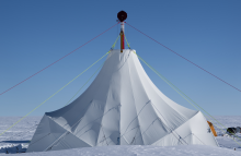 a tent in the middle of an ice field