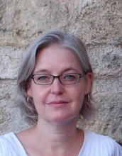 portrait of Jean Cottam Allen with short grey hair and wearing glasses