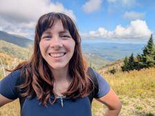 portrait of female with a landscape background