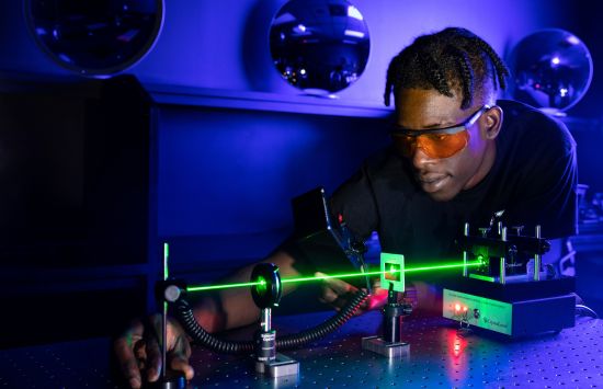 ATE student learning to measure output power from a laser