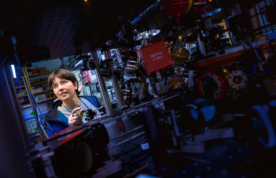 RQS Co-PI Alicia Kollár examines equipment