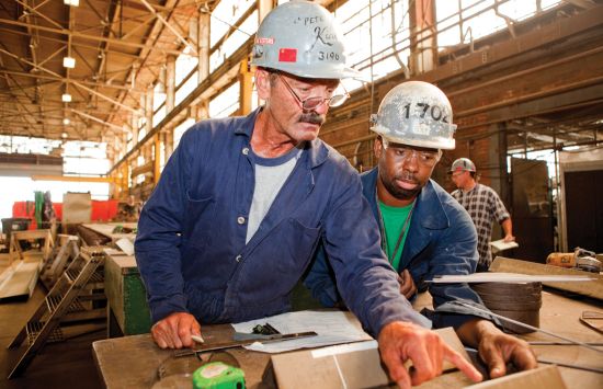 Two workers wearing hard hats