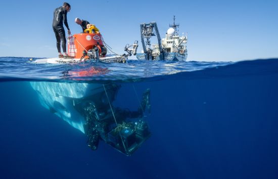 Alvin swimmers preparing the sub at the surface for recovery operations.