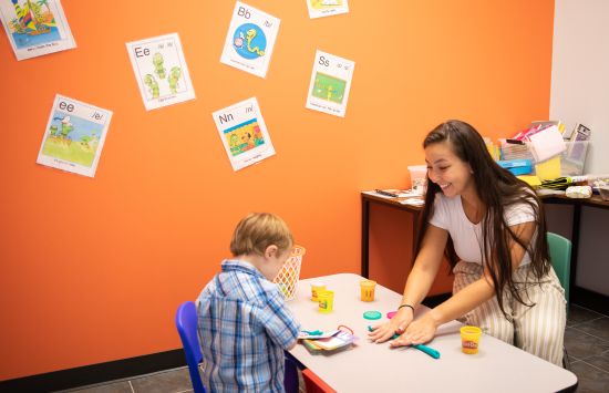 student interacting with teacher