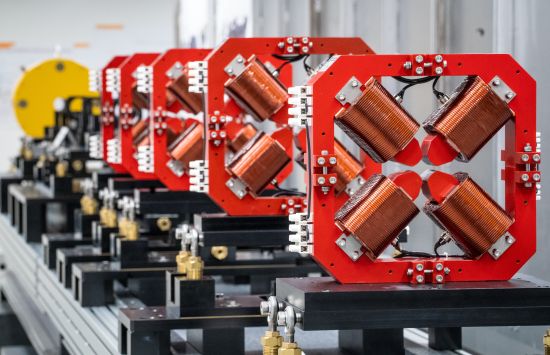 A series of large magnets in a laboratory