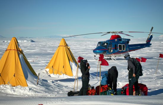 A Weddell seal research team from Montana State University near the Erebus Glacier Tongue on the frozen annual sea ice of McMurdo Sound.