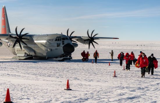 A New York Air Guard LC-130 brings 21 passengers to the NSF Amundsen-Scott South Pole Station.