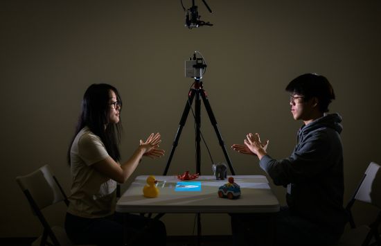 two college students facing each other