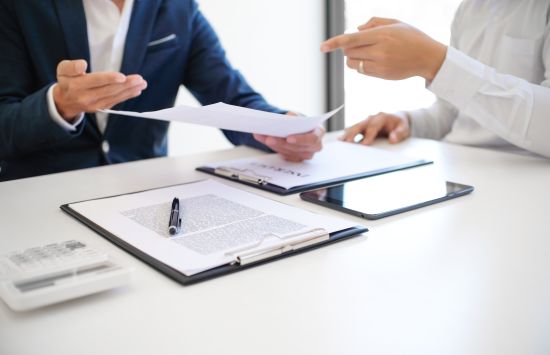 Business people signing contract making a deal with real estate agent Concept for consultant and home insurance. Real estate investment Property insurance and security. Real estate agent offer