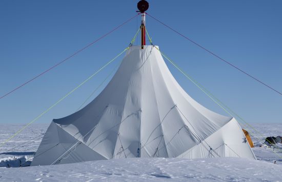 A large white tent on the ice.