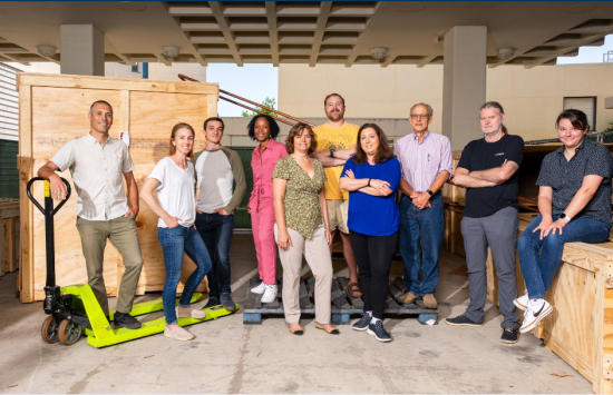 A photo of the UCSB team standing up the new NSF ExFAB BioFoundry among the first shipment of equipment for the new ExFAB facility.