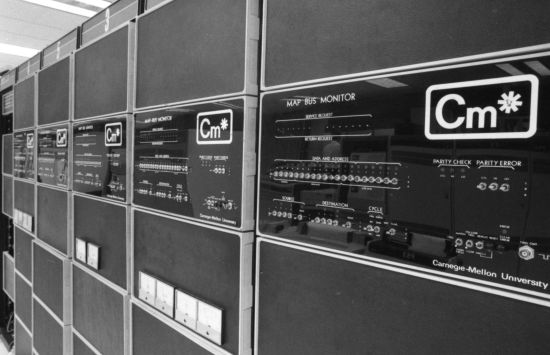 A black-and-white photo of a room full of computers, circa 1970s or 1980s.