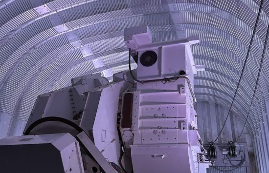 Instruments in a dimly lit enclosed area.