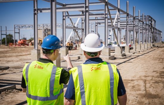 Construction workers at a manufacturing facility