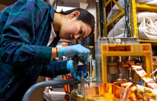 Cyndia Yu works on a component of the Keck Array, a telescope designed to study the Cosmic Microwave Background.