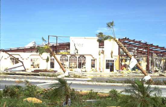 A photograph of a building destroyed by a hurricane.