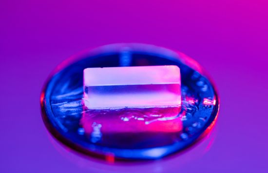 A highly transparent, flourine-rich crystal with thorium-229 atom trapped inside