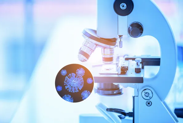 A microscope is shown with a cutaway to a illustration of the SARS-COVID-2 virus