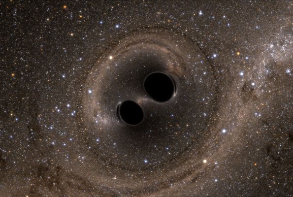 Computer illustration depicting two black holes merging